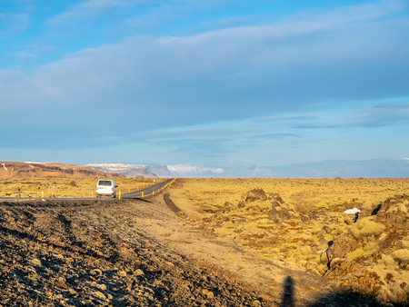 Road with surrounding view of nature in Iceland, mountain and fieldの写真素材