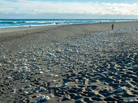 Black sand diamond beach with wave and snow mountains in winter season in Icelandの写真素材