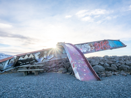 HOF, ICELAND - MARCH 4 : Skeidara Bridge Monument, twisted girders remain of Icelandic bridge that was wiped out by a combination of volcanic heat and glacial floods under morning twilight sky in Iceland, on March 4, 2018.のeditorial素材