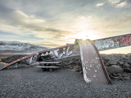 HOF, ICELAND - MARCH 4 : Skeidara Bridge Monument, twisted girders remain of Icelandic bridge that was wiped out by a combination of volcanic heat and glacial floods under morning twilight sky in Iceland, on March 4, 2018.のeditorial素材