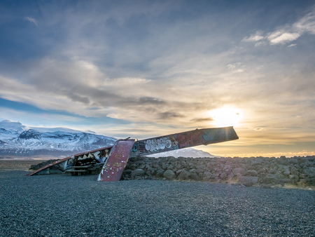 HOF, ICELAND - MARCH 4 : Skeidara Bridge Monument, twisted girders remain of Icelandic bridge that was wiped out by a combination of volcanic heat and glacial floods under morning twilight sky in Iceland, on March 4, 2018.のeditorial素材
