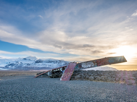 HOF, ICELAND - MARCH 4 : Skeidara Bridge Monument, twisted girders remain of Icelandic bridge that was wiped out by a combination of volcanic heat and glacial floods under morning twilight sky in Iceland, on March 4, 2018.のeditorial素材