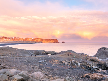 Coastline view with mountains near Dyrholaey, Vik town in Iceland, during twilight evening sky in winter seasonの写真素材