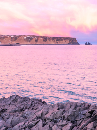 Coastline view with mountains near Dyrholaey, Vik town in Iceland, during twilight evening sky in winter seasonの写真素材