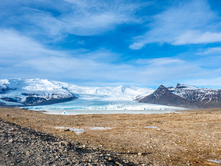 Fjallsarlon glacier, one of famous iceberg lagoon, become hard ice in winter season at south end of Icelandの写真素材