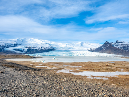 Fjallsarlon glacier, one of famous iceberg lagoon, become hard ice in winter season at south end of Icelandの写真素材