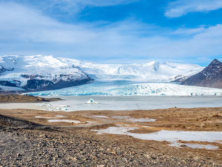 Fjallsarlon glacier, one of famous iceberg lagoon, become hard ice in winter season at south end of Icelandの写真素材