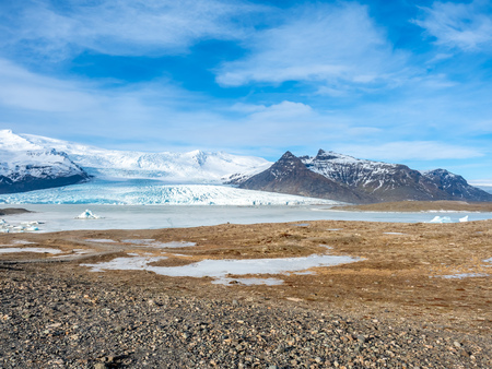 Fjallsarlon glacier, one of famous iceberg lagoon, become hard ice in winter season at south end of Icelandの写真素材