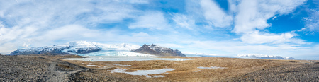 Fjallsarlon glacier, one of famous iceberg lagoon, become hard ice in winter season at south end of Icelandの写真素材