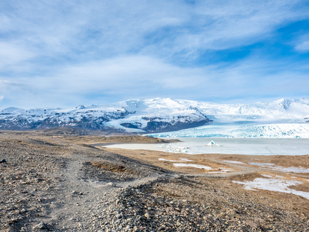 Fjallsarlon glacier, one of famous iceberg lagoon, become hard ice in winter season at south end of Icelandの写真素材