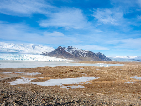 Fjallsarlon glacier, one of famous iceberg lagoon, become hard ice in winter season at south end of Icelandの写真素材