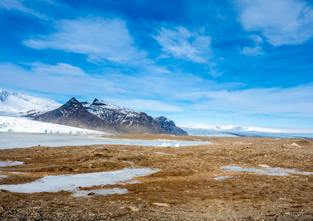 Fjallsarlon glacier, one of famous iceberg lagoon, become hard ice in winter season at south end of Icelandの写真素材