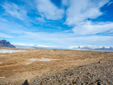 Fjallsarlon glacier, one of famous iceberg lagoon, become hard ice in winter season at south end of Icelandの写真素材