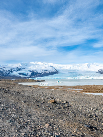 Fjallsarlon glacier, one of famous iceberg lagoon, become hard ice in winter season at south end of Icelandの写真素材
