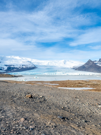 Fjallsarlon glacier, one of famous iceberg lagoon, become hard ice in winter season at south end of Icelandの写真素材