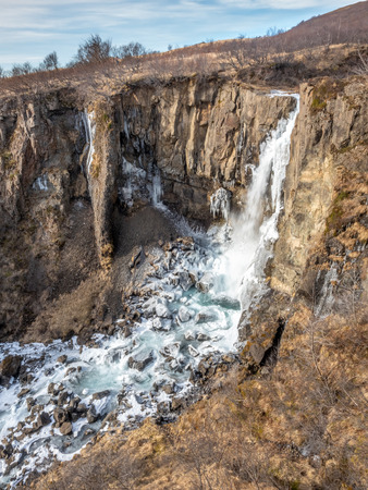 Hundafoss waterfall near Svartifoss in winter season with frozen river, one of destination landmark in Icelandの写真素材