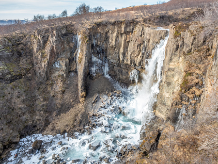 Hundafoss waterfall near Svartifoss in winter season with frozen river, one of destination landmark in Icelandの写真素材