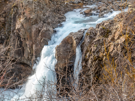 Hundafoss waterfall near Svartifoss in winter season with frozen river, one of destination landmark in Icelandの写真素材