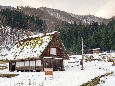 Gassho-zukuri unique architecture house in Shirakawa village, the UNESCO world heritage place, with snow in early winter season in Gifu, Japanのeditorial素材