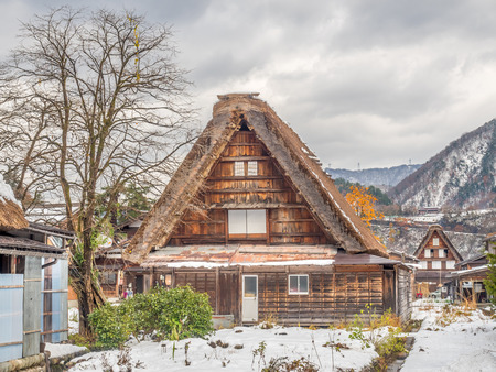 Gassho-zukuri unique architecture house in Shirakawa village, the UNESCO world heritage place, with snow in early winter season in Gifu, Japanのeditorial素材