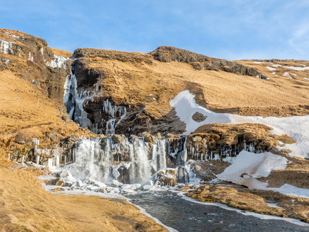 Gluggafoss, large waterfall, in winter season under blue sky in Icelandの写真素材