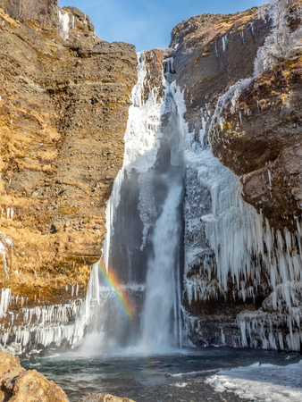 Gluggafoss, large waterfall, in winter season under blue sky in Icelandの写真素材