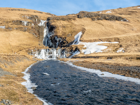 Gluggafoss, large waterfall, in winter season under blue sky in Icelandの写真素材