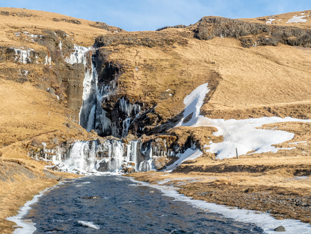 Gluggafoss, large waterfall, in winter season under blue sky in Icelandの写真素材
