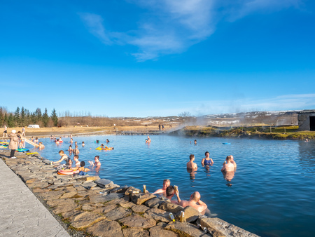 FLUDIR, ICELAND - MARCH 6 : Secret lagoon hot spring, public outdoor warming swimming pool, landmark of small city of Fludir, Iceland, was taken on March 6, 2018.のeditorial素材