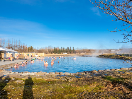 FLUDIR, ICELAND - MARCH 6 : Secret lagoon hot spring, public outdoor warming swimming pool, landmark of small city of Fludir, Iceland, was taken on March 6, 2018.のeditorial素材