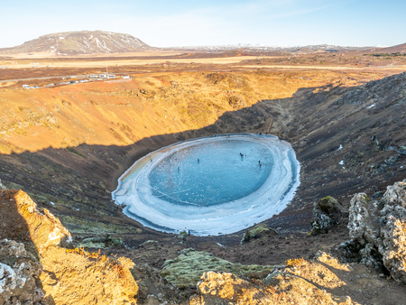 Kerid crater, huge quiet volcanic crater, in winter season become hard ice lake, in Iceland along golden circle road tripの写真素材