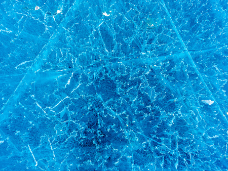 Abstract ice pattern on lake at Kerid crater, old quiet volcano in Iceland, in winter seasonの写真素材
