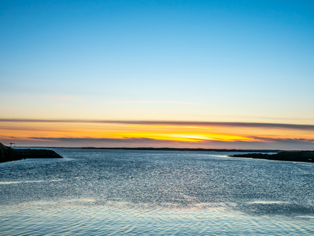 Seascape view from cape of Borganes pier under twilight evening sky in Icelandの写真素材