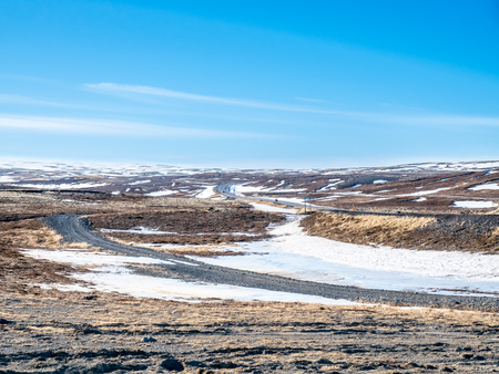 Landscape beautiful view, lake, mountains and field under cloudy blue sky in winter season, Icelandの写真素材