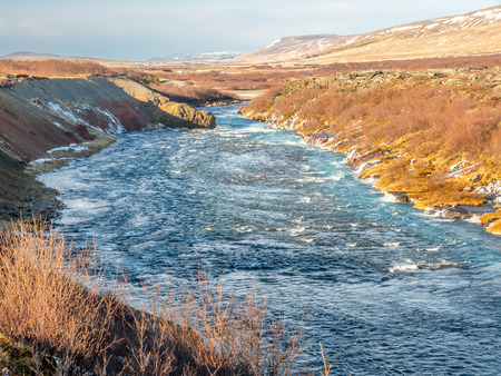 Hraunfossar waterall, Lava fall, one of unusual beautiful water cliff in Icelandの写真素材