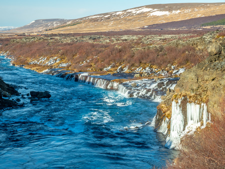 Surrounding view around Hraunfossar waterfall, unusual beautiful natural landmark in Iceland, during winter seasonの写真素材