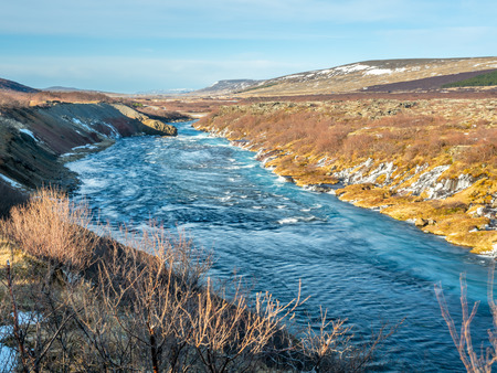 Hraunfossar waterall, Lava fall, one of unusual beautiful water cliff in Icelandの写真素材