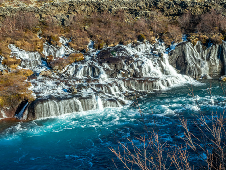 Hraunfossar waterall, Lava fall, one of unusual beautiful water cliff in Icelandの写真素材