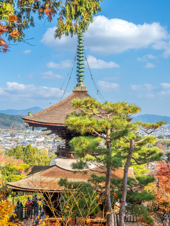 ARASHIYAMA, JAPAN - NOVEMBER 27 : Arashiyama cityscape viewpoint with autumn tree forest with mountains in background and landmark Japanese style pagoda, Japan, on November 27, 2017.のeditorial素材