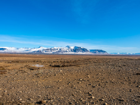 Natural scenic view of mountains and field in winter season in Icelandの写真素材