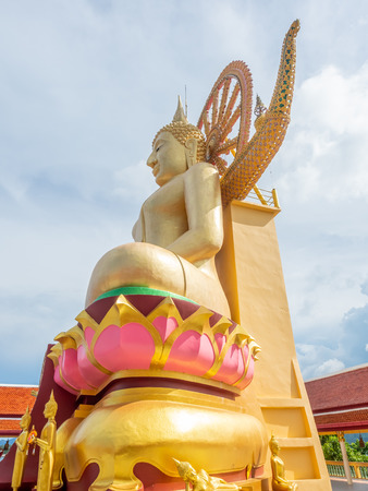 Big buddha, large sculpture of Lord Buddha in outdoor temple, under cloudy blue sky in summer season, Samui island, Thailandの写真素材