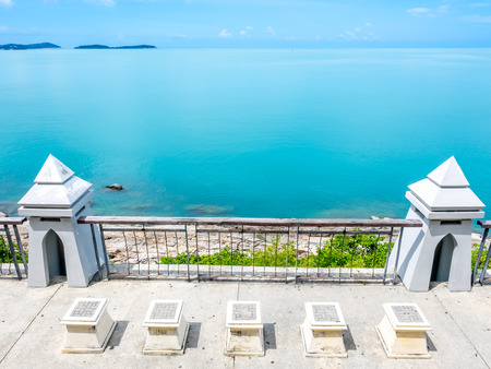 Architecture at landmark viewpoint with seascape view of Samui island, Thailand, under cloudy blue skyの写真素材