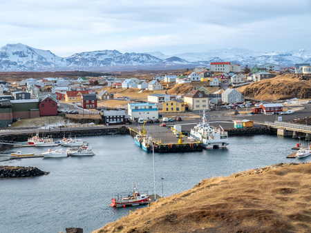 STYKKISHOLMUR, ICELAND - MARCH 9 : Commercial harbor with ships and boats in bays with cityscape view at Stykkisholmur town in Iceland, was taken on March 9, 2018.のeditorial素材