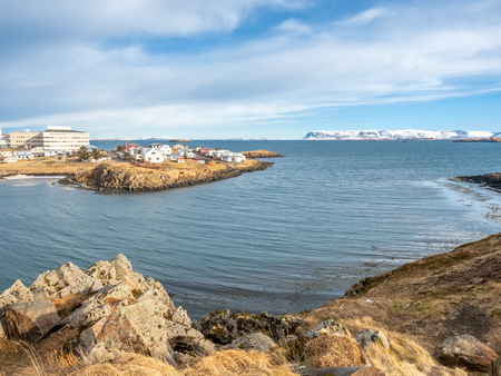 Seascape view from church hill at viewpoint of Stykkisholmur city under cloudy blue sky, Icelandの写真素材