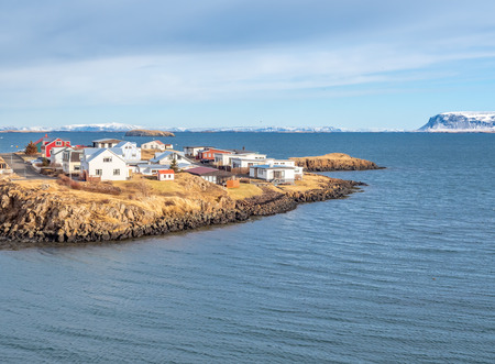 Seascape view from church hill at viewpoint of Stykkisholmur city under cloudy blue sky, Icelandの写真素材