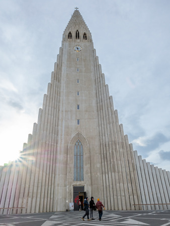 REYKJAVIK, ICELAND - MARCH 10 : Front side of Hallgrimskirkja church, the most famous landmark place of Iceland, under cloudy morning blue sky in winter season, Reykjavik, Iceland, was taken on March 10, 2018.のeditorial素材