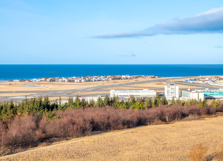 Cityscape of Reykjavik, capital city of Iceland, under cloudy blue sky from Perlan Observatory deck viewpointの写真素材
