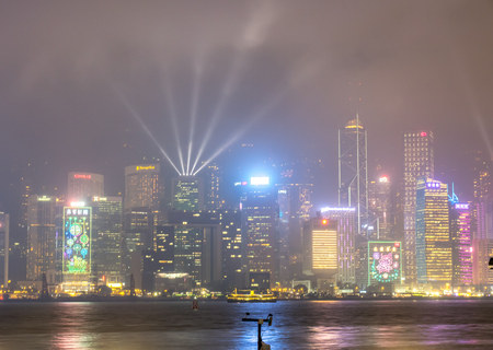 HONG KONG, CHINA - JANUARY 19 : Night light show with skyscraper buildings at Victoria harbor, Hong Kong, China, on January 19, 2018.のeditorial素材