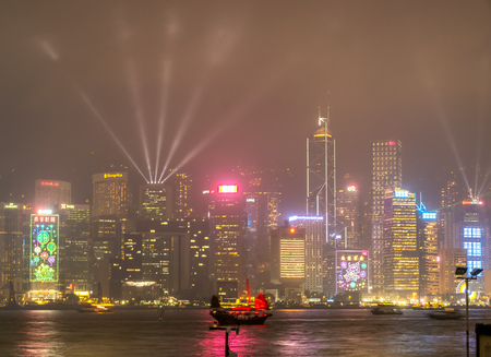 HONG KONG, CHINA - JANUARY 19 : Night light show with skyscraper buildings at Victoria harbor, Hong Kong, China, on January 19, 2018.のeditorial素材