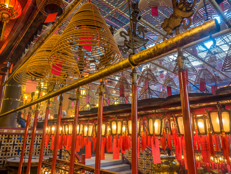 HONG KONG, CHINA - JANUARY 20 : Man Mo temple with full of incense smoke from respect people, landmark at central district of Hong Kong, China, on January 20, 2018.のeditorial素材
